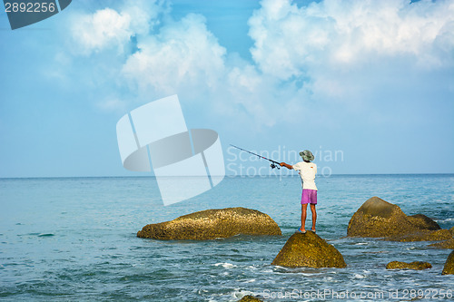 Image of Local man fishing with rod