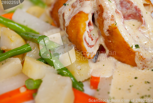 Image of Chicken Cordon Bleu with boiled potatoes and vegetables