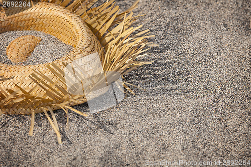 Image of Tourists went home. Hat lying on the beach - rubbish