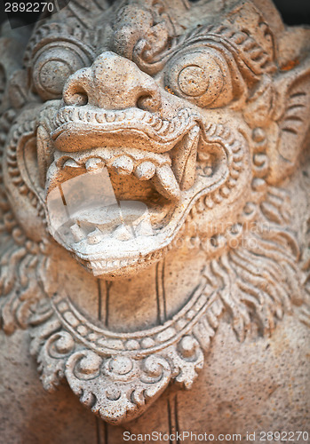 Image of Muzzle of terrible mythical monster. Stone statue from Indonesia