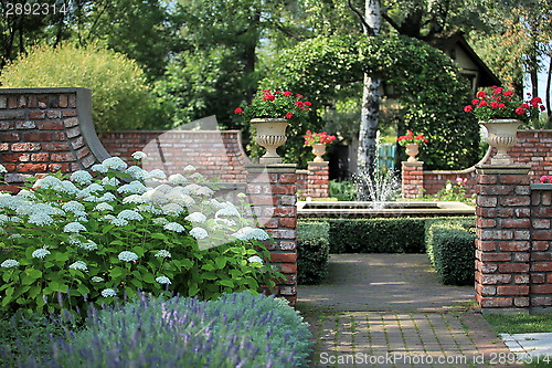 Image of English  garden with a fountain