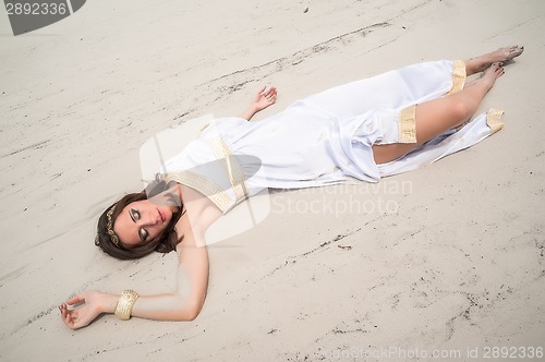 Image of Young attractive woman in greek tunic