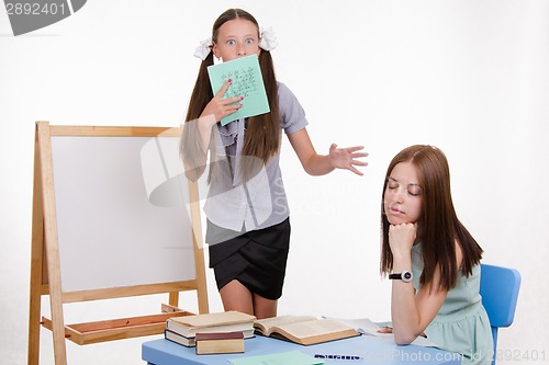 Image of teacher went to sleep as student meets blackboard