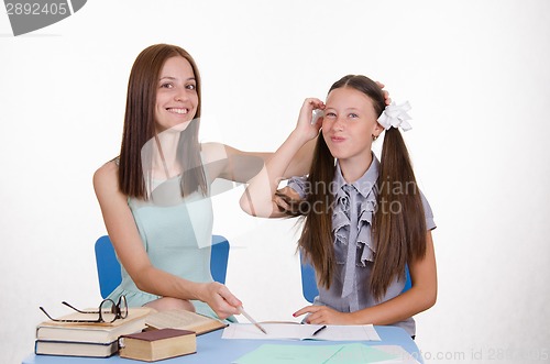 Image of Girl thought doing homework