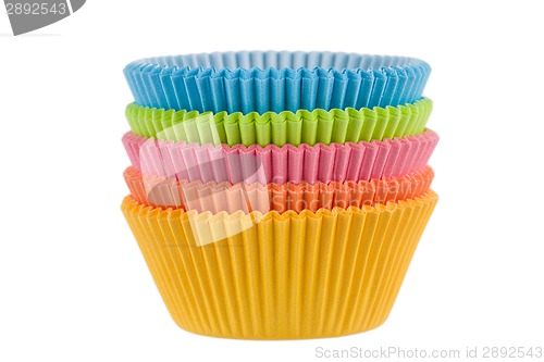 Image of Colorful empty muffin cups on a white background 