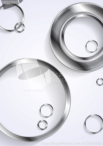 Image of Metallic circles on white background