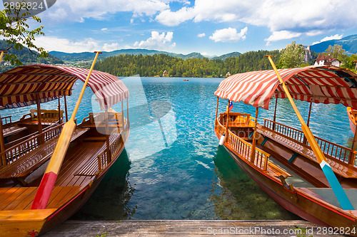 Image of Traditional wooden boats on lake Bled, Slovenia.