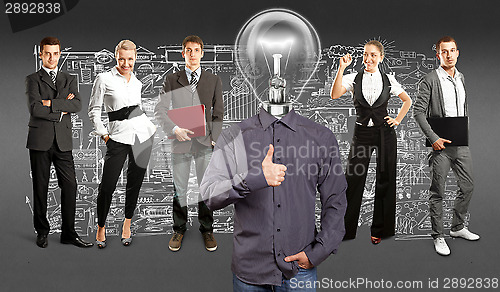 Image of Business Team With Lamp Head