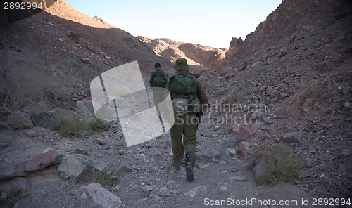 Image of Soldiers patrol in desert