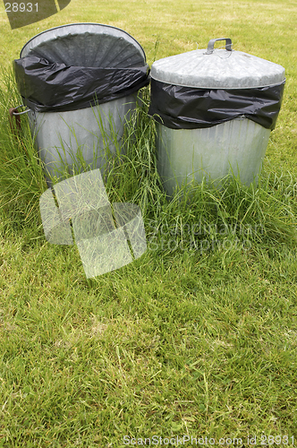 Image of waste bins in grass