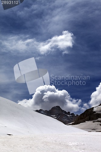 Image of Rocks with clouds and snowy plateau