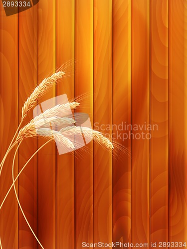 Image of Wheat spikes on wooden board. EPS 10