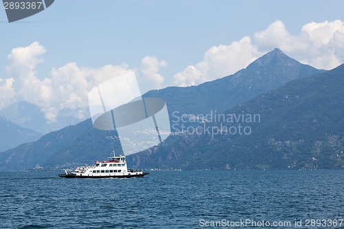 Image of Boat against mountains on Lake Como