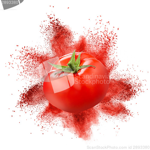 Image of Tomato with red powder explosion isolated on white