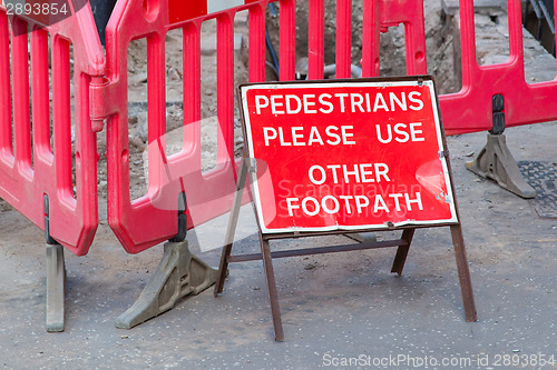 Image of Construction sign standing on footpath