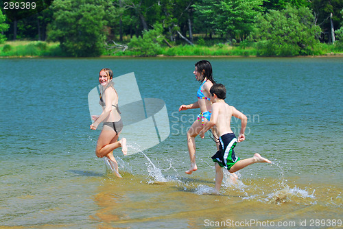 Image of Children running into water