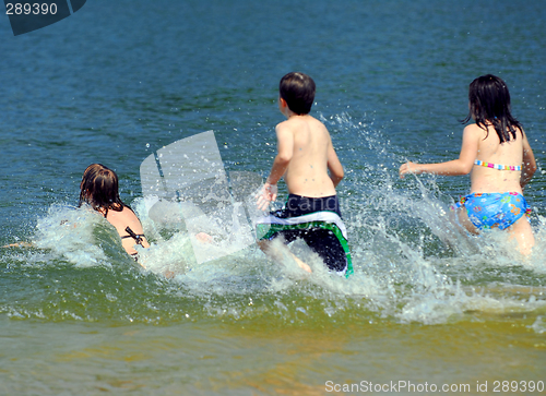 Image of Children running into water