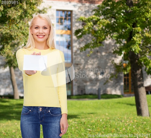 Image of smiling girl with blank business or name card