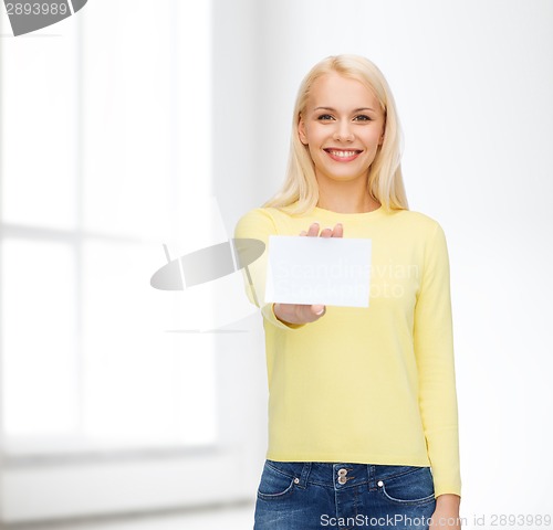 Image of smiling girl with blank business or name card