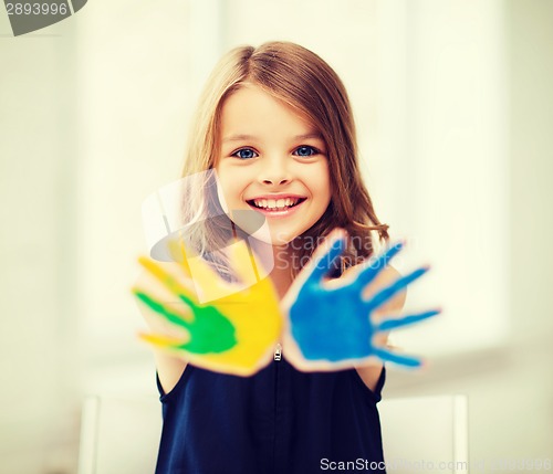 Image of girl showing painted hands