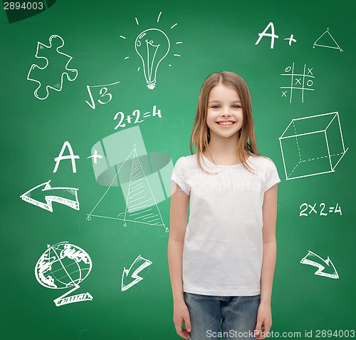 Image of smiling little girl in white blank t-shirt