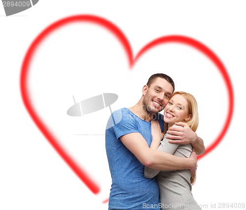 Image of smiling couple hugging