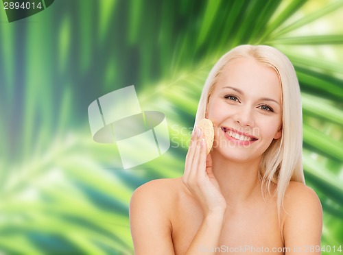 Image of beautiful woman with sponge