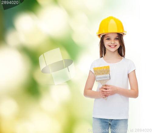 Image of smiling little girl in helmet with paint brush