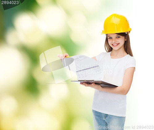 Image of smiling little girl in hardhat with clipboard