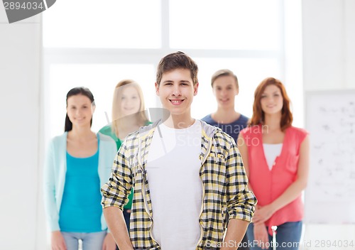 Image of smiling male student with group of classmates