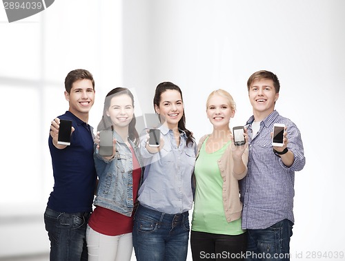 Image of students showing blank smartphones screens