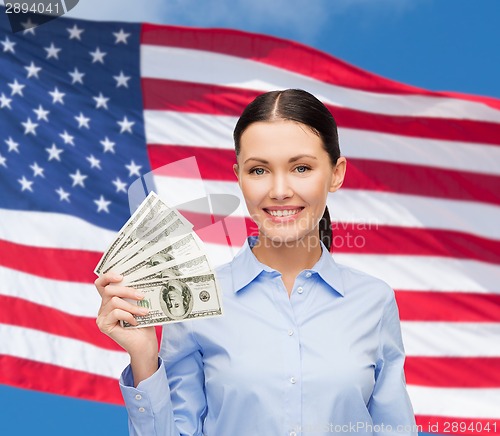 Image of businesswoman with dollar cash money