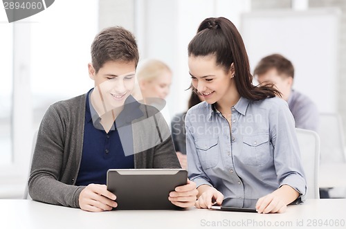 Image of students looking at tablet pc in lecture at school