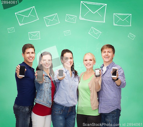 Image of group of smiling students showing smartphones