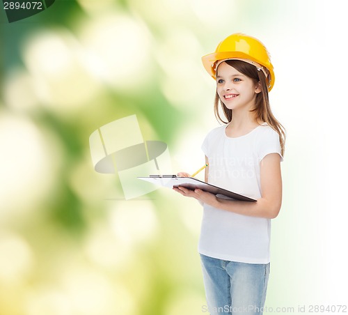 Image of smiling little girl in hardhat with clipboard