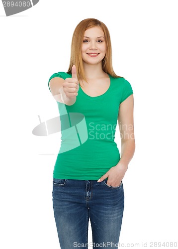 Image of smiling teenage girl showing thumbs up