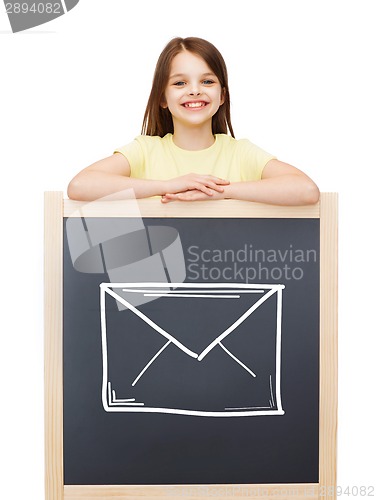 Image of happy little girl with blackboard