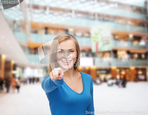 Image of smiling student pointing finger at you