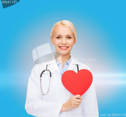 Image of smiling female doctor with heart and stethoscope