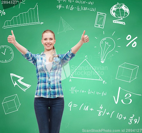 Image of smiling student girl showing thumbs up