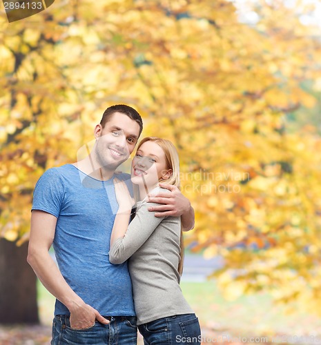 Image of smiling couple hugging