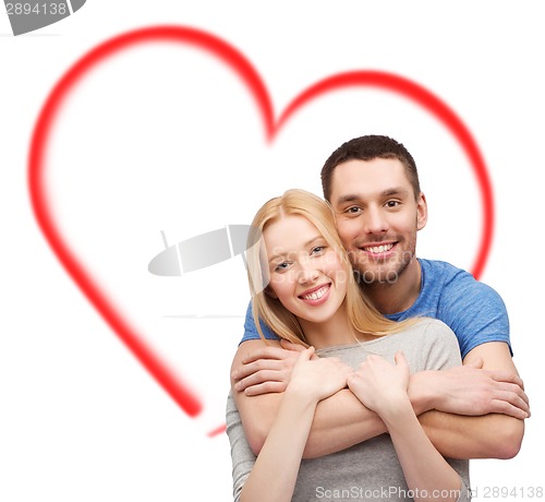 Image of smiling couple hugging