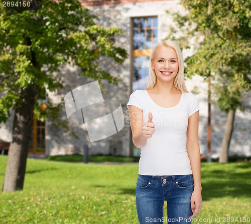 Image of woman showing thumbs up