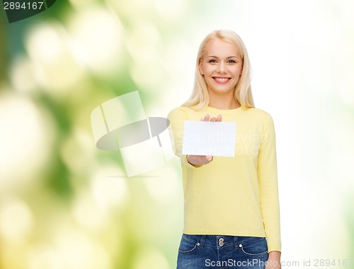 Image of smiling girl with blank business or name card