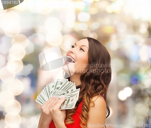 Image of woman in red dress with us dollar money