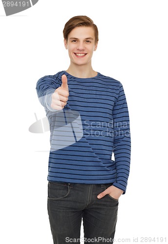 Image of smiling teenage boy showing thumbs up