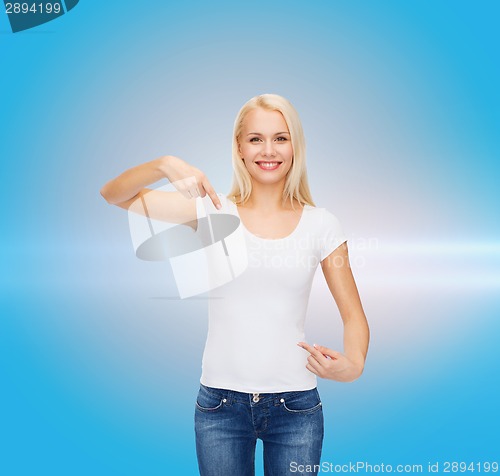 Image of smiling young woman in blank white t-shirt