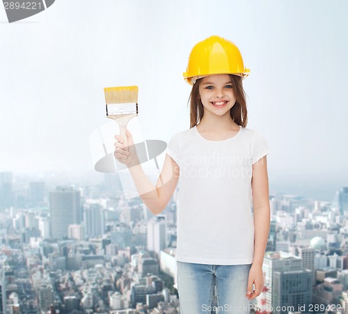 Image of smiling little girl in helmet with paint brush