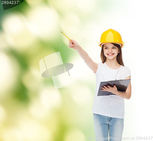 Image of smiling little girl in hardhat with clipboard