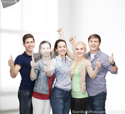 Image of group of smiling students showing thumbs up